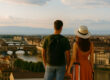 boy and girl holding hands against the backdrop of Florence