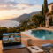 Luxury villa with swimming pool overlooking the Italian coast, representing professional short-term rental management services for premium holiday properties by Geco Vacation Rentals.